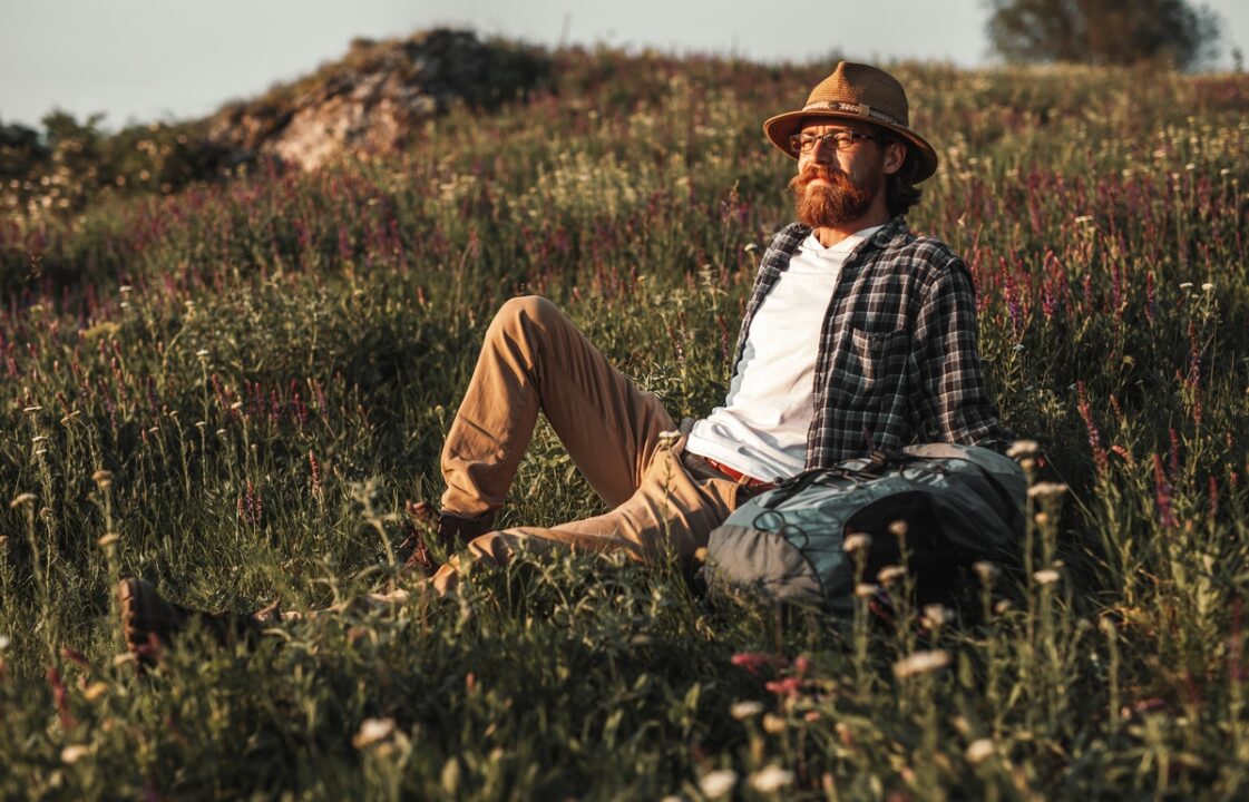 Bearded man resting in countryside